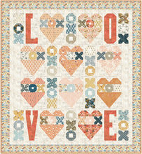 Load image into Gallery viewer, Fall N&#39; Love heart quilt pattern by Audrey Tanke for BasicGrey. Fat eighth friendly quilt feature hearts, Xs and Os, and lots of L-O-V-E. Featured fabric is Cider by BasicGrey for Moda Fabrics. (Would be cute in Nutmeg fabric.) Download the PDF pattern here.